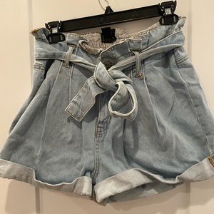 High waisted shorts with a belt that ties in the front